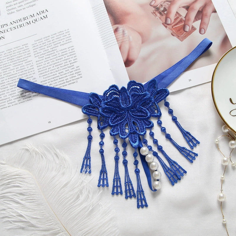 Embroidered low waist pearl massage crotchless thong