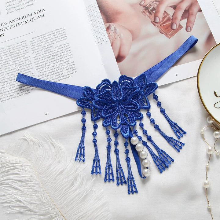 Embroidered low waist pearl massage crotchless thong